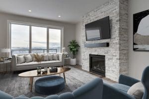 The Britannia Great Room By Renova Homes & Renovations livig room with stone fireplace