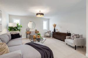 Crimson Ridge Bonus room with couch and accent greenery