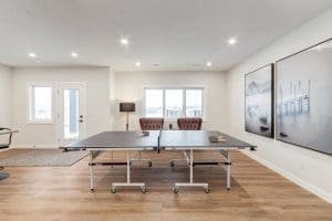 Crimson Ridge Showhome Basement Ping Pong table hang out hub