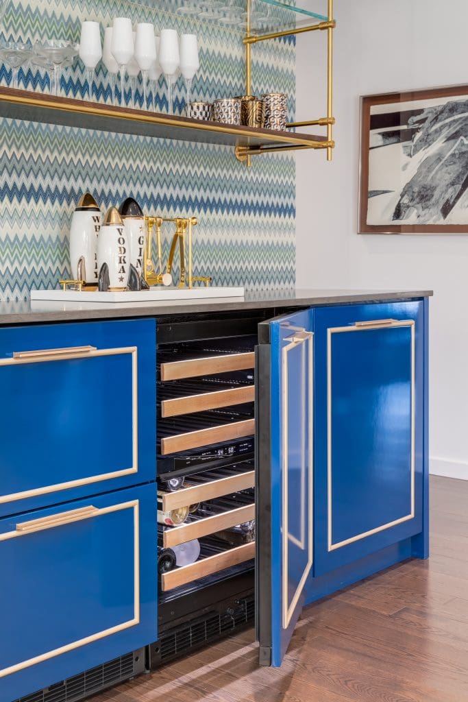 Custom built in fridge with blue doors and metal hardware