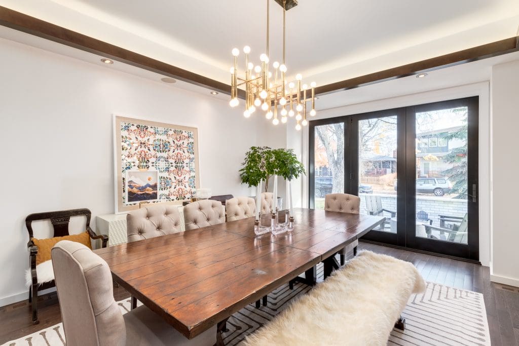 Dining Room table with chairs and bench overlooking patio doors