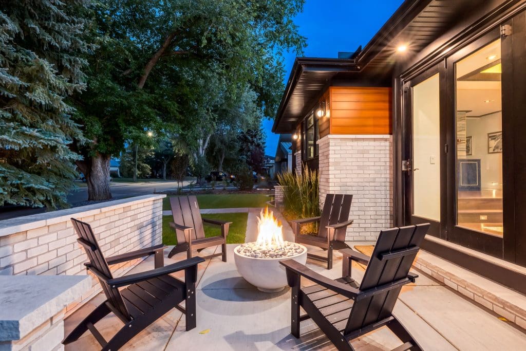 Exterior front patio with propane fireplace Custom Renovation