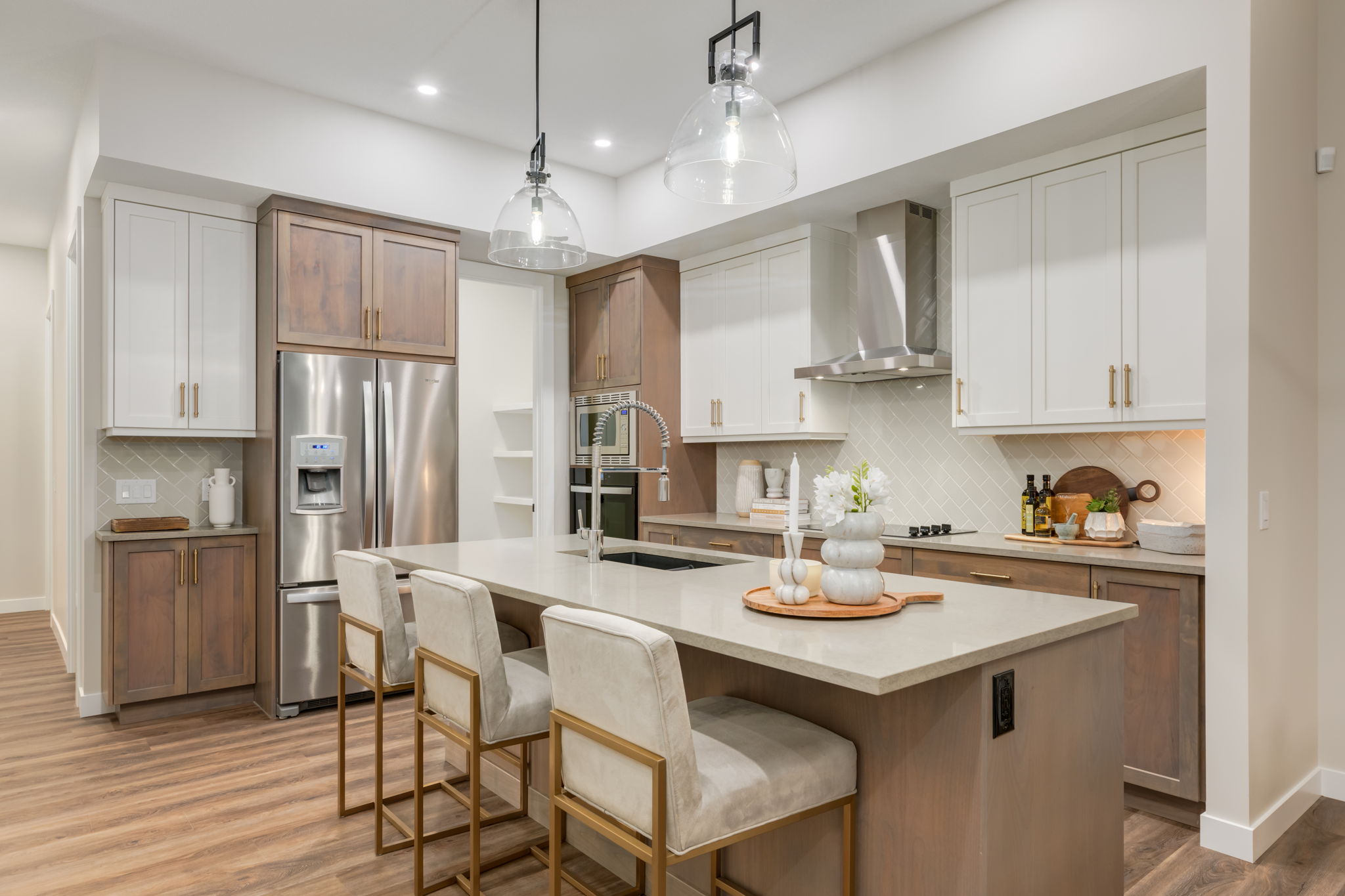 River Pointe Villas By RENOVA Homes & Renovations Kitchen Island with Glass lights